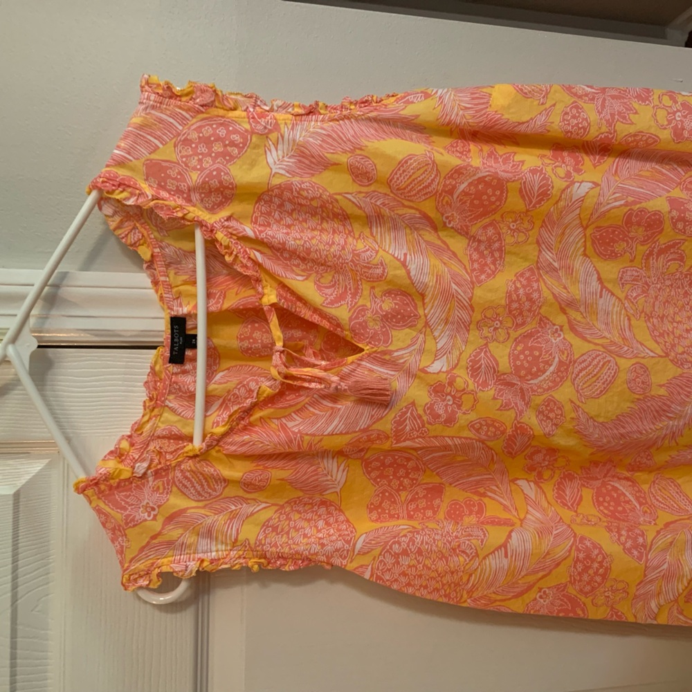 Very light weight summer sleeveless top. Cute tie at chest.